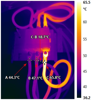 Infrared image of the compressor isolator showing one terminal at 65.8 degrees Celsius