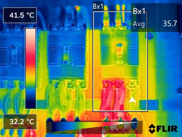 FLIR thermal image of a row of breakers where one unit's connections glow hot against its neighbours